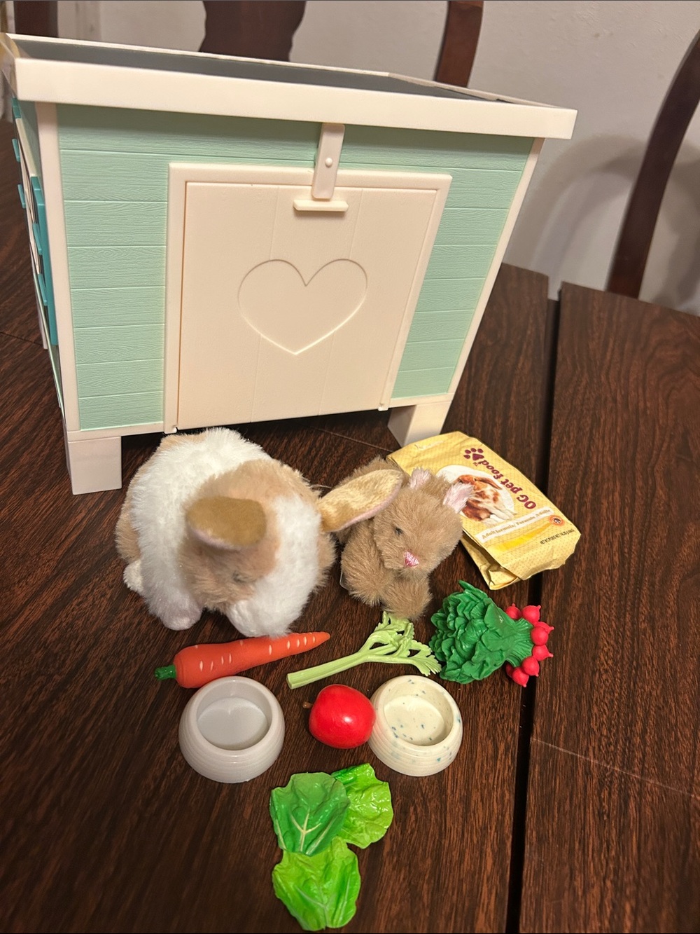 Our Generation mother and baby rabbits with hutch and food.